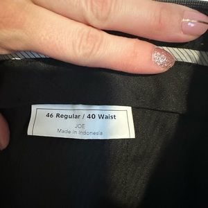 Gray suit worn 1-2 times for very short periods of time. Like new quality!